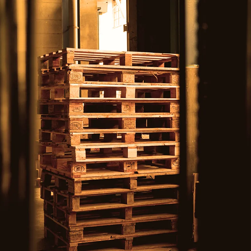 wooden pallets in the warehouse of the company - client City Profit